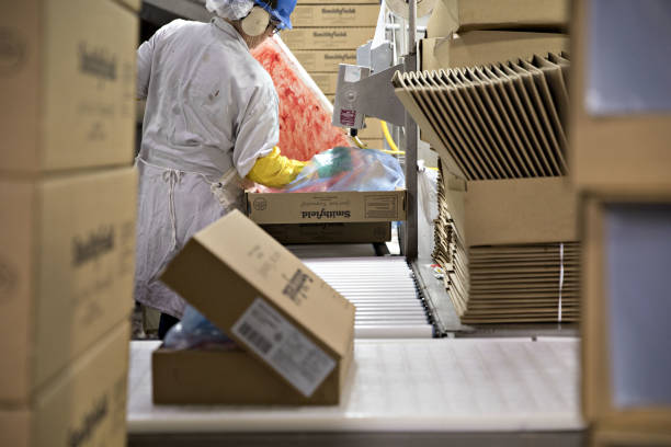 The Smithfield Foods Inc. logo is displayed on a box at the company's pork processing facility in Milan, Missouri, U.S., on Wednesday, April 12, 2017. WH Group Ltd. acquired Virginia-based Smithfield, the world's largest pork producer, in 2013 for $6.95 billion. As Smithfield can't export sausage, ham and bacon from its U.S. factories, because China prohibits imports of processed meat, WH Group opened an 800 million-yuan ($116 million) factory in Zhengzhou that will produce 30,000 metric tons of those meats when it reaches full capacity next year. Photographer: Daniel Acker/Bloomberg via Getty Images