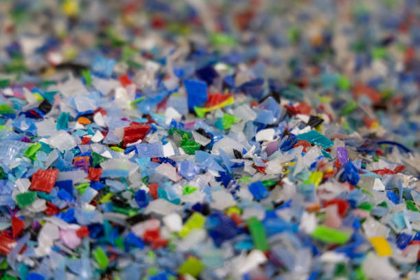 Multi-colored plastic flakes at a recycling center. Photographer: SeongJoon Cho/Bloomberg